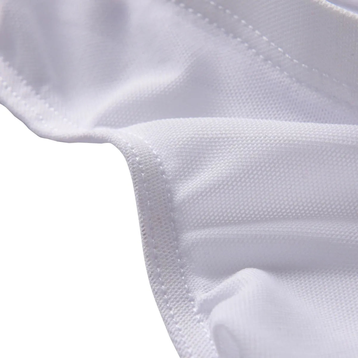 Men's black low-waist nylon briefs laid flat, showing triangle brief style and knitted fabric.