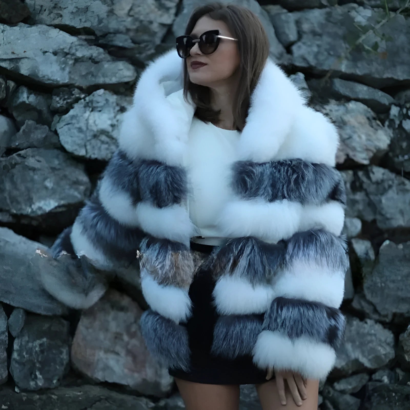 Loose-fitting hooded women's coat in artificial fur, shown in brown and white silver fox colours.