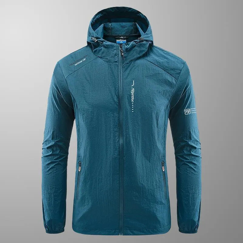 Man wearing a light grey loose-fitting hooded nylon summer jacket for sun protection.