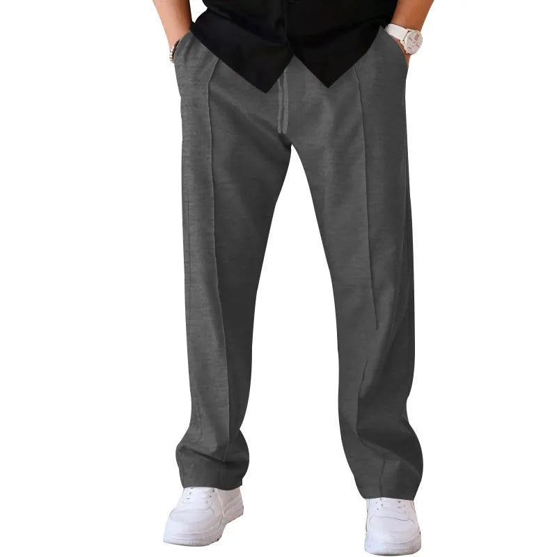 Men's loose straight drawstring trousers in waffle polyester fabric, shown in multiple colour options