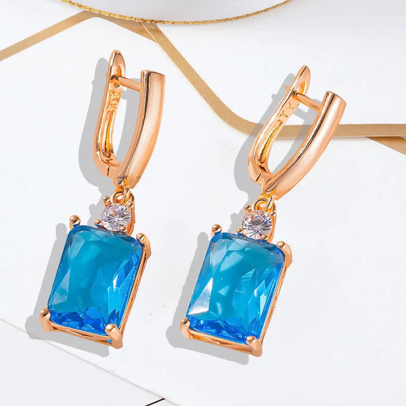 Square geometric earrings with electroplated gold or silver finish on copper, showing quadrilateral design elements