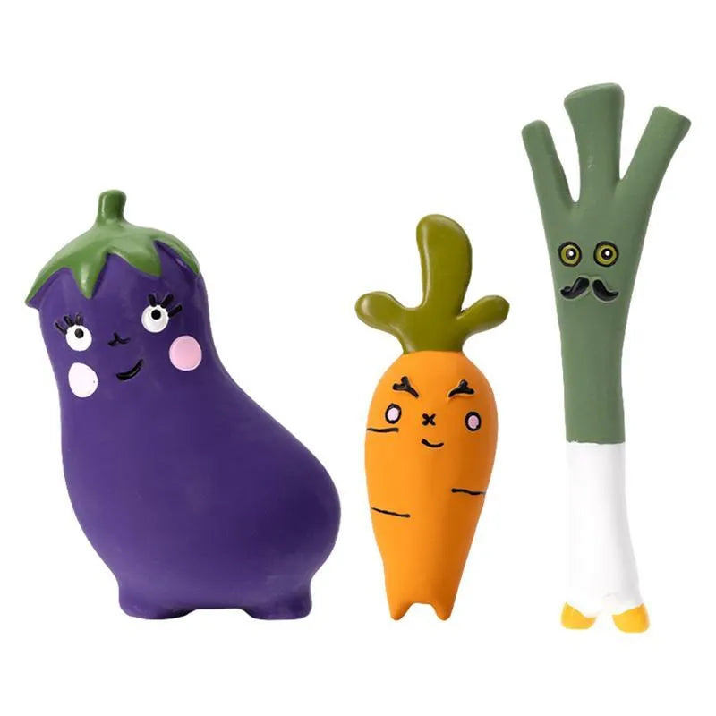 Green, orange, and purple latex vegetable dog chew toys with cartoon onion and eggplant designs