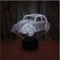 Black acrylic LED table lamp with remote control on wooden desk