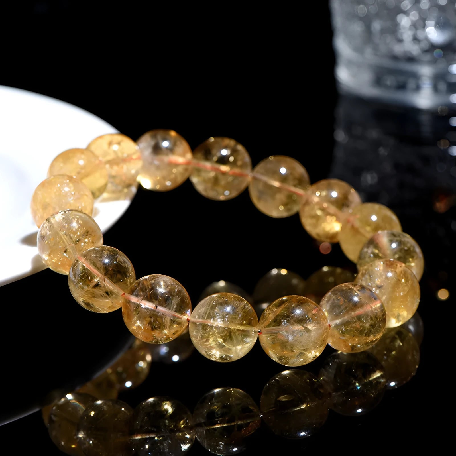 Natural yellow citrine gemstone bracelet showing geometric beads on a string.