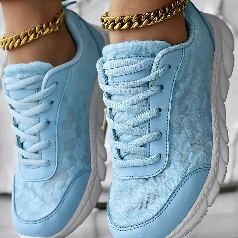 Women's lightweight canvas running shoes in white, black, blue or pink with soft sole and flat heel