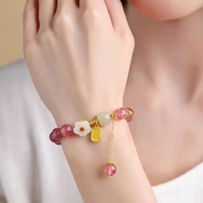Hetian jade and strawberry quartz crystal bracelet for women showing manual craftsmanship and natural stone variations