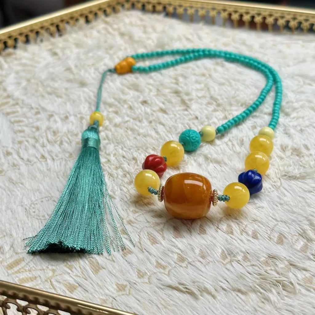 Turquoise stone mesh flower pendant on a silver ball bead necklace, adjustable length.