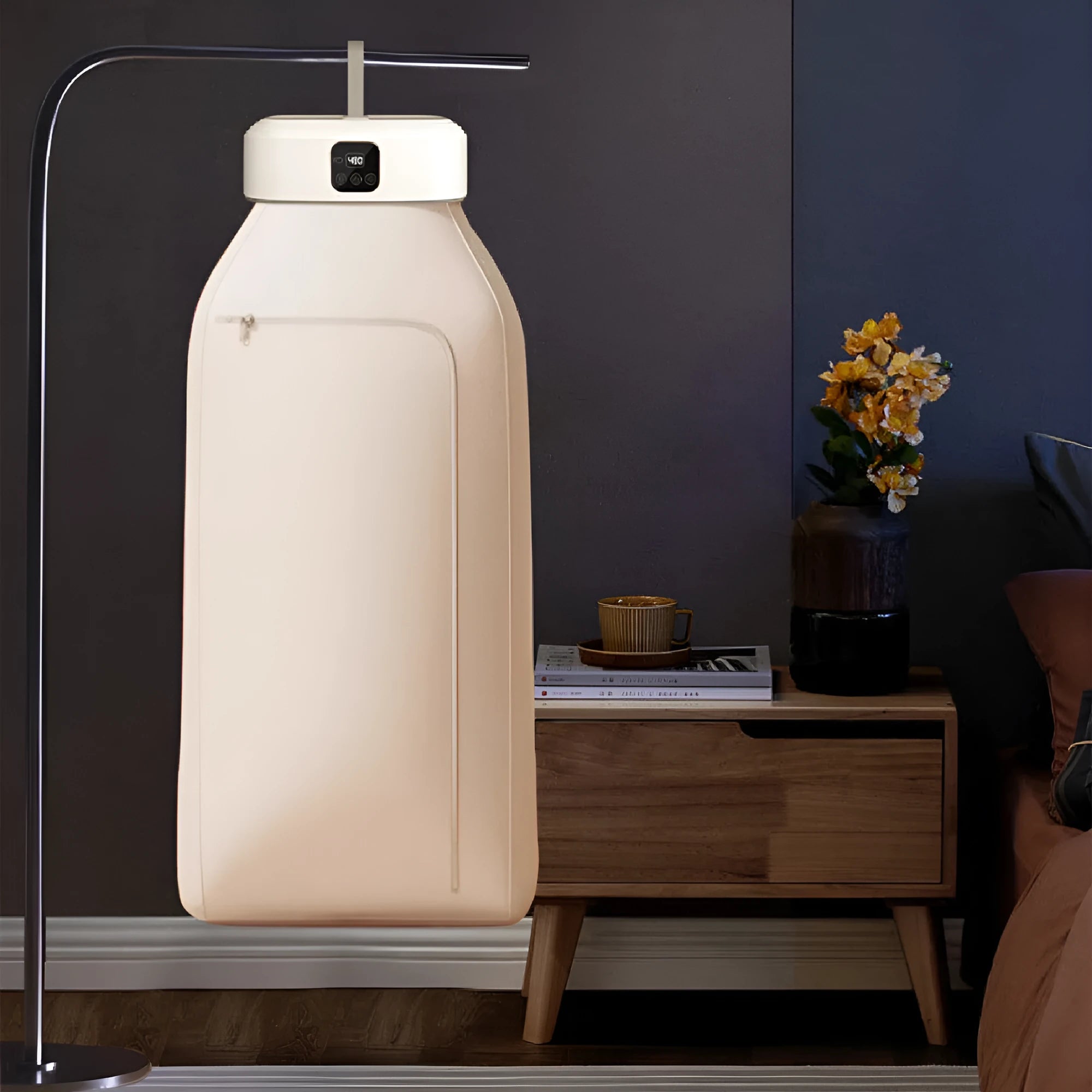 White cylindrical compact laundry dryer with remote control for dormitory use