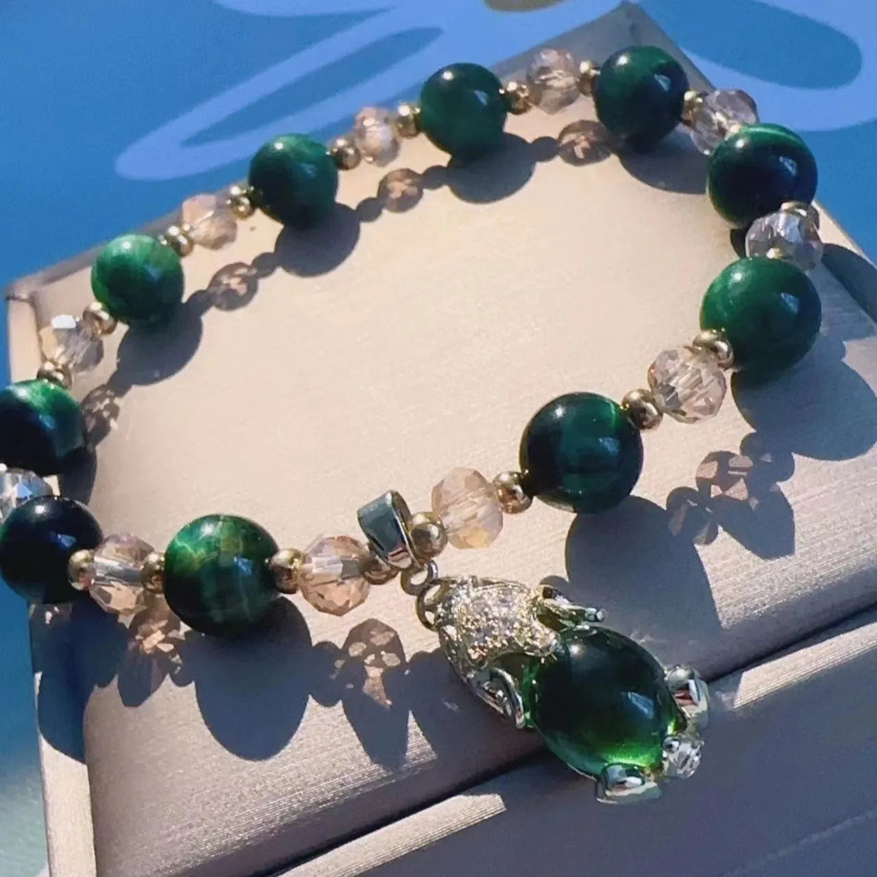 Handmade natural Vanves stone Tigereye bracelet on wrist showing single or double chain with fox motif.