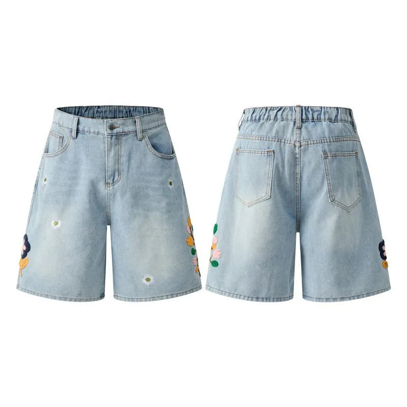 Retro grey washed cotton shorts with a zipper fly and loose fit on a mannequin.