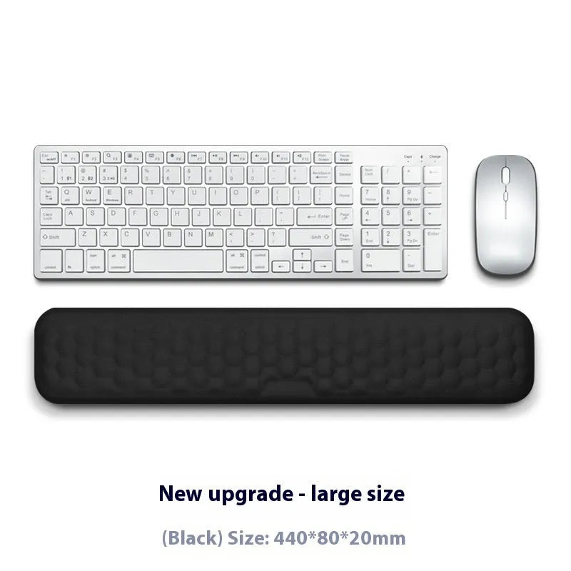 Grey and black memory foam mouse wrist pads with silicone bases, shown in cloth and leather cover options.