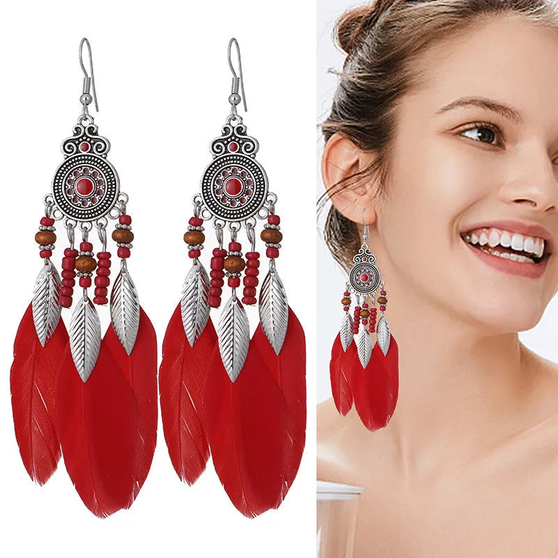 Round drop feather earrings with leaf patterning in alloy, available in multiple electroplated colours.