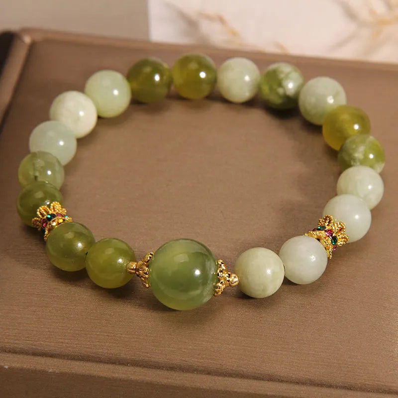 Women's bracelet made of green Xiuyan jade in an original sweet Mori style design.