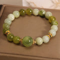 Women's bracelet made of green Xiuyan jade in an original sweet Mori style design.