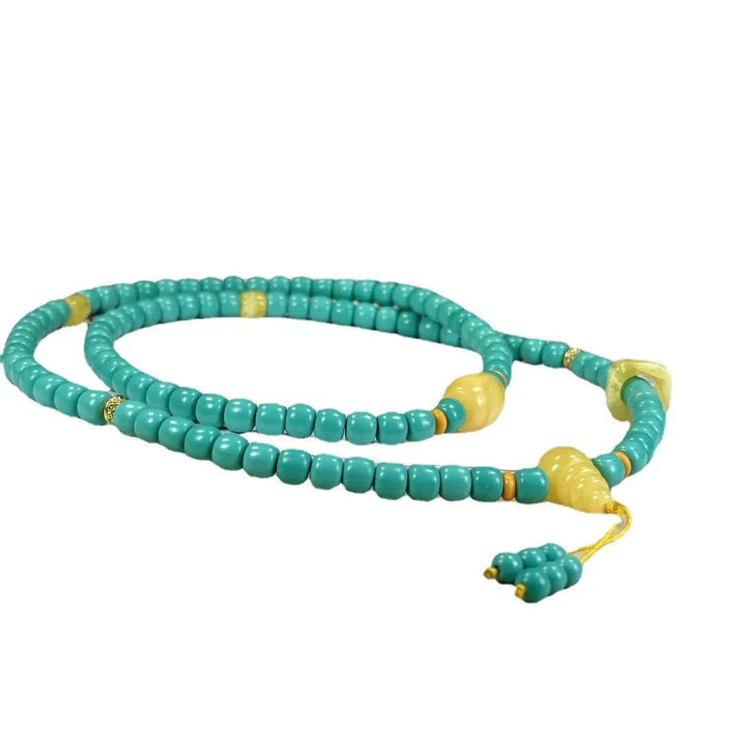 Turquoise stone mesh flower pendant on a silver ball bead necklace, adjustable length.