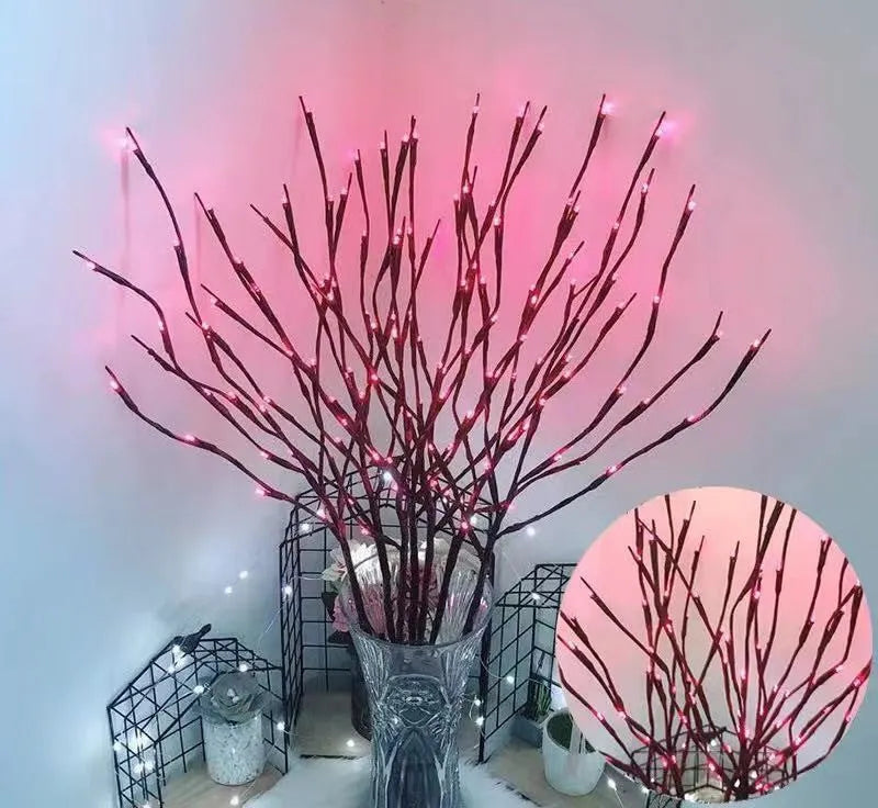 LED decorative tree light in a vase with silver branches illuminated in a choice of six colours.
