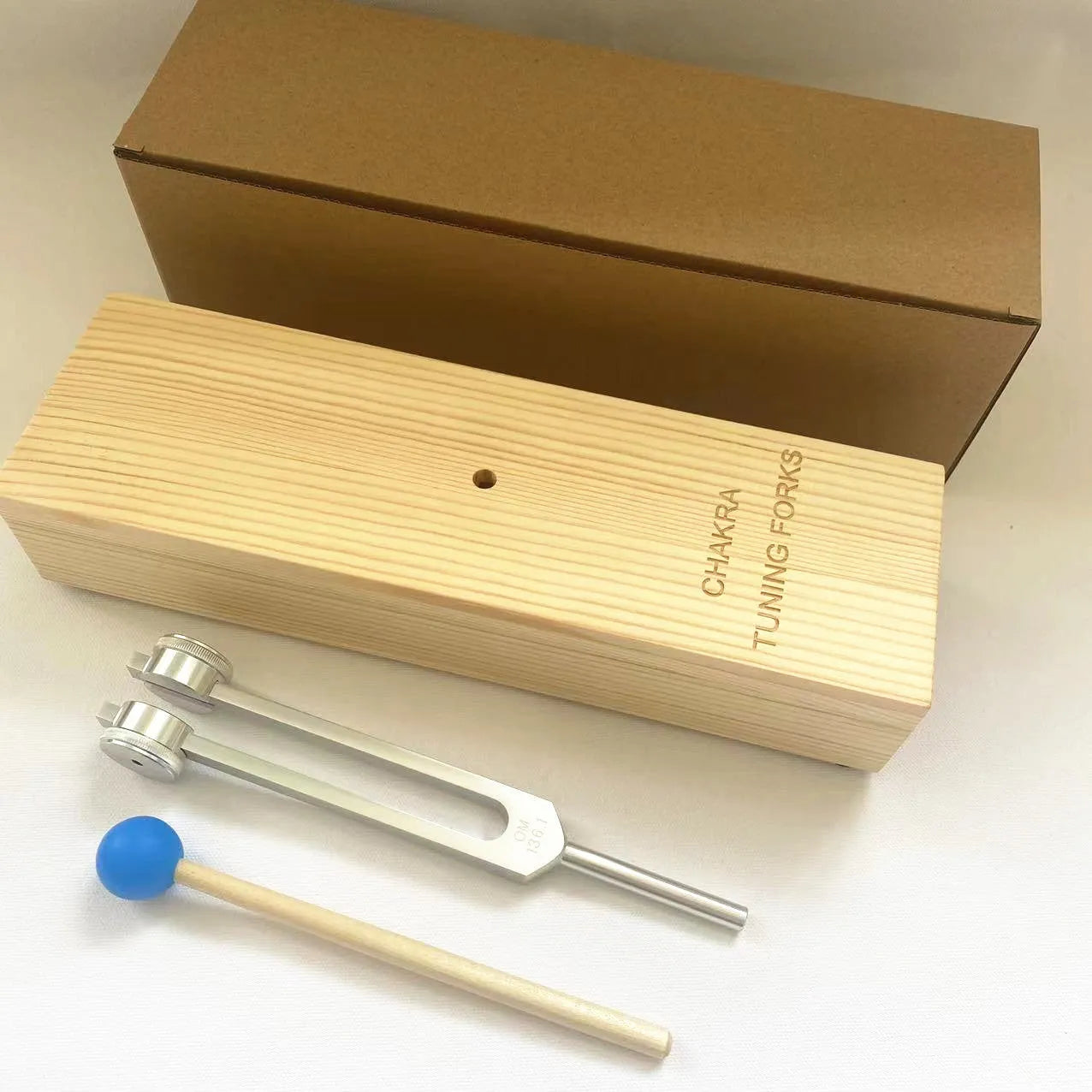 432Hz aluminum tuning fork with speaker set in kraft paper packaging