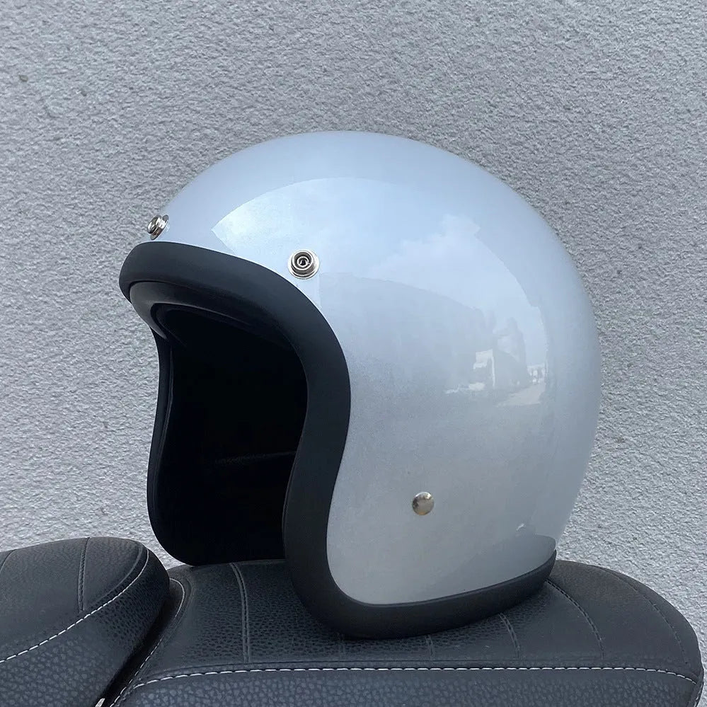 Retro-style half motorcycle helmet in fibreglass, shown in a cement grey colour option.