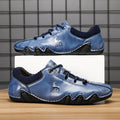 Men's solid colour lace-up casual sneakers with car stitching, blue upper, side view