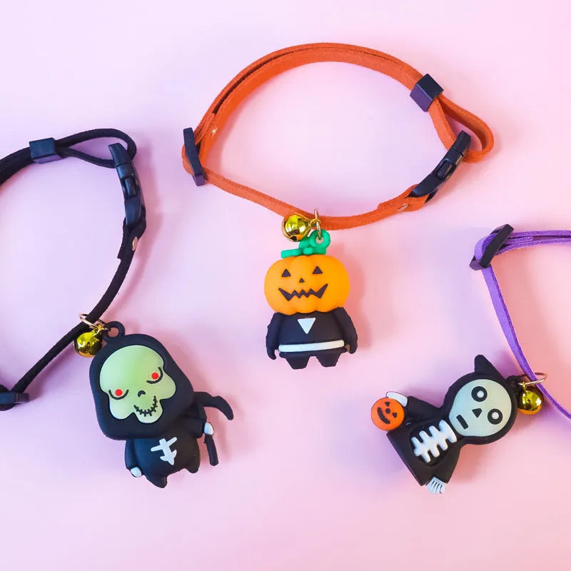 Halloween dog collar with pumpkin man and glow-in-the-dark skull designs in adjustable sizes.