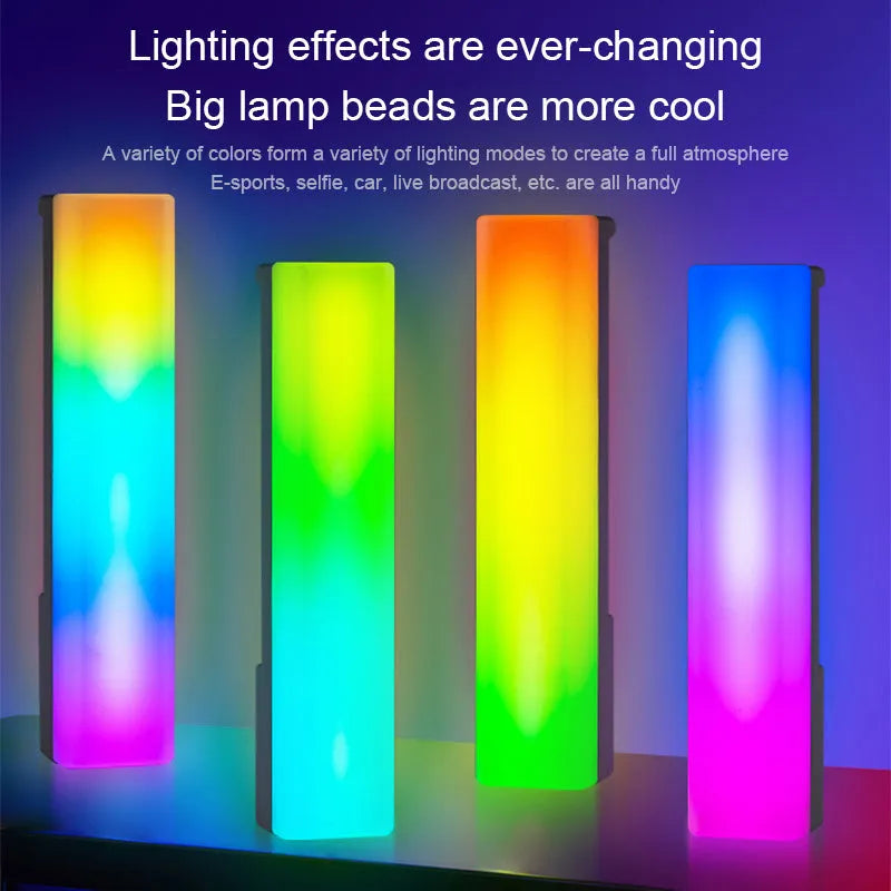Tall 3D RGB LED ambience lamp with colourful lights on a desk, showcasing its voice-activated music rhythm mode.