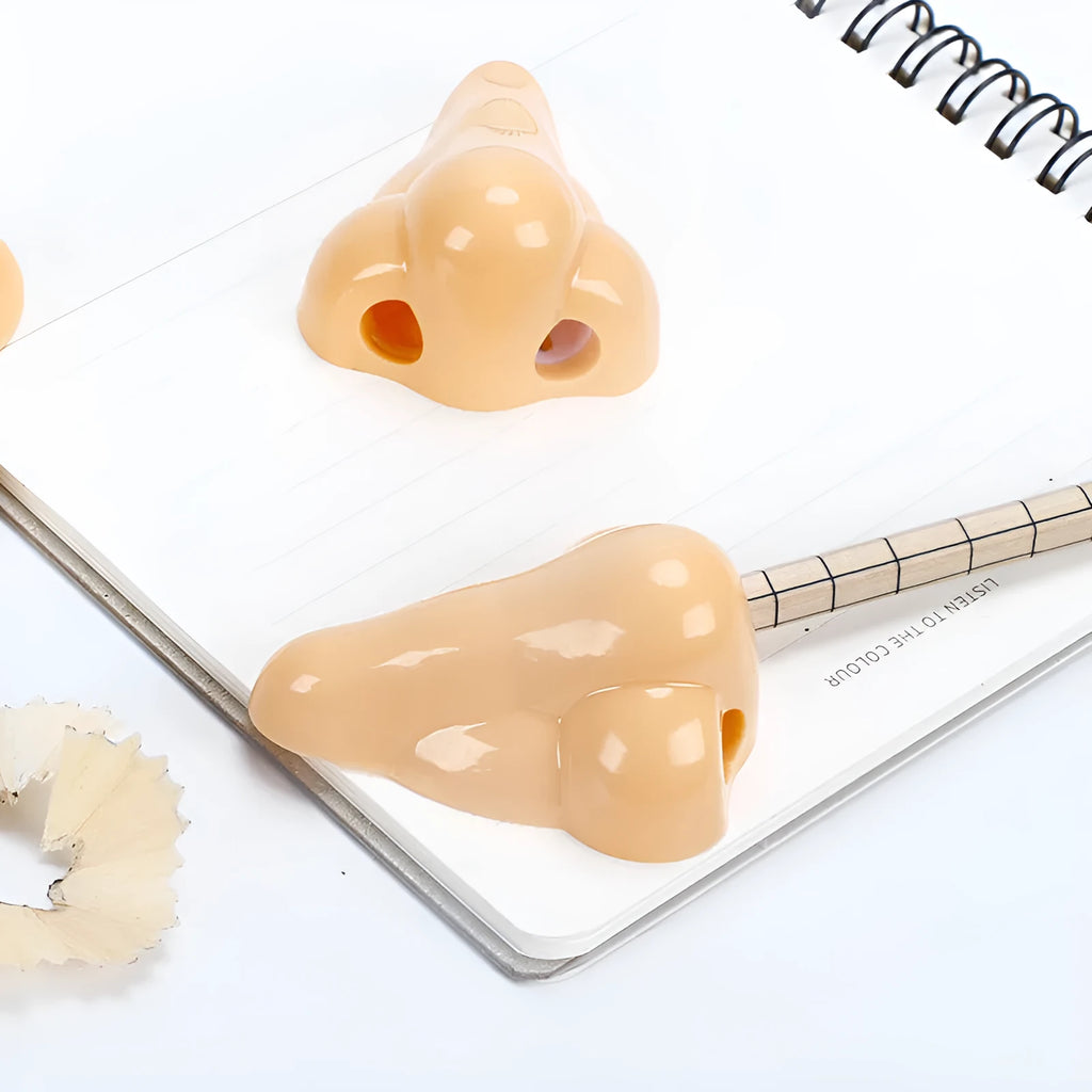 Flesh colour plastic pencil sharpener with geometry shape