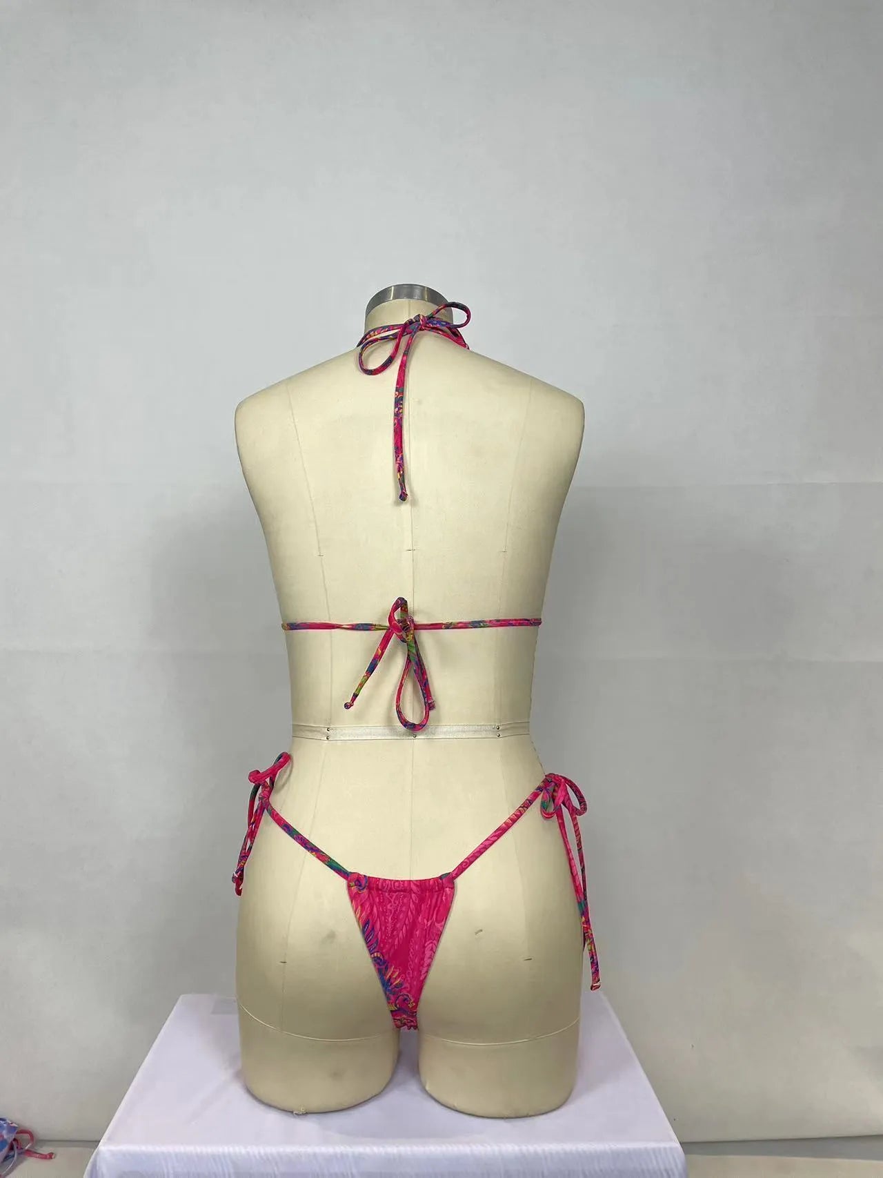 Women's printed bikini two-piece set in pink with triangle top and high-waist bottoms