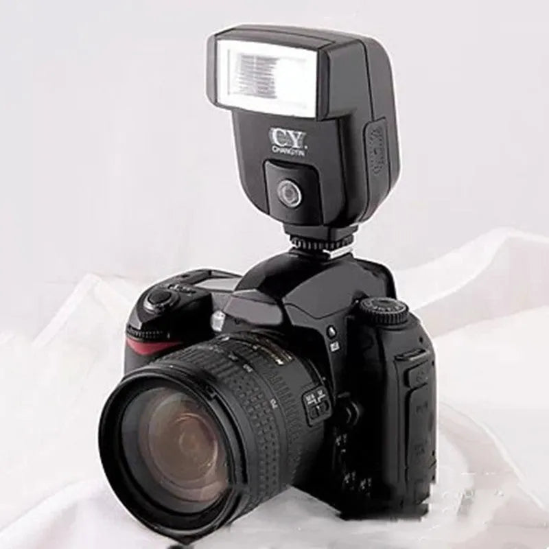 SLR camera flash unit with tilting head shown at 90-degree angle, compact 65x60x98mm design