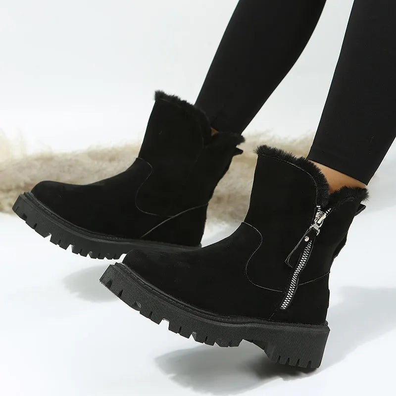 Women's black faux suede high-top snow boots with side zipper and thick plush lining.