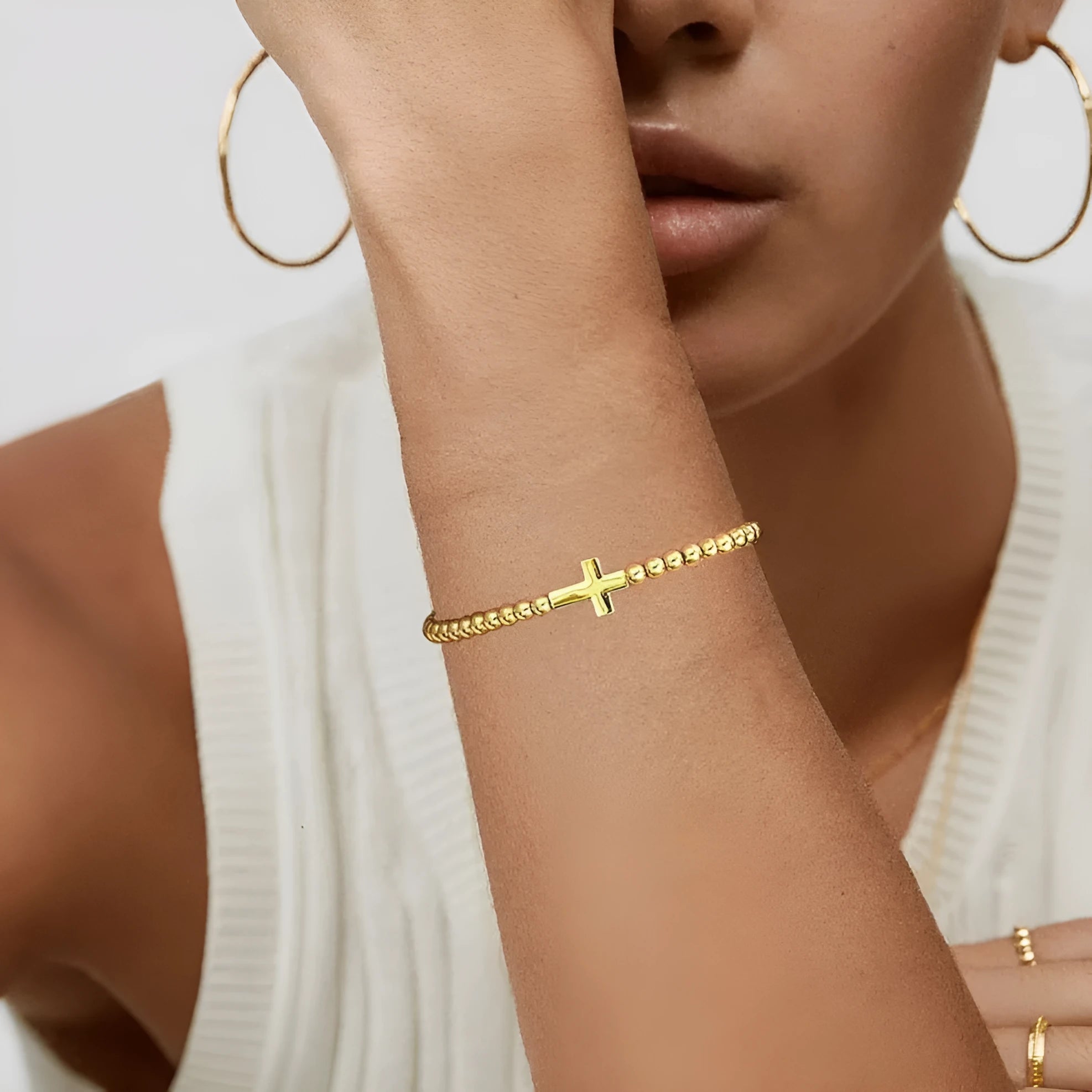 Adjustable stainless steel beaded bracelet with round beads in a simple geometric design.