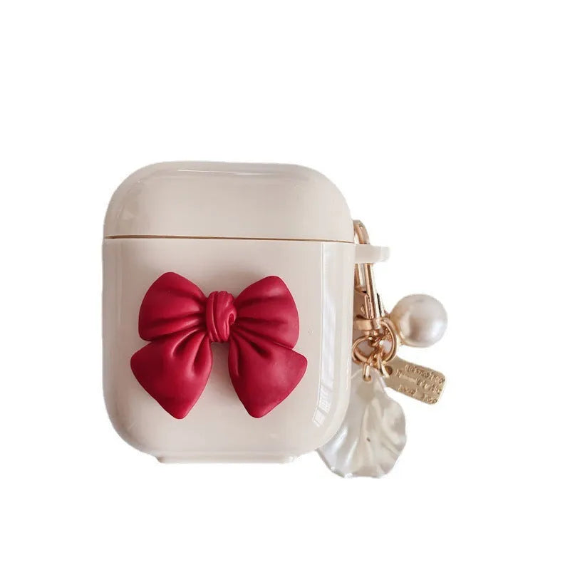 Beige red bow shell TPU protective case cover for AirPods showing clamshell design