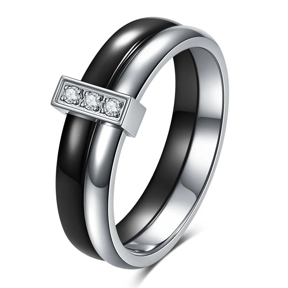 Steel black ceramic women's ring with glossy stitching and zirconium accents, geometric shape.