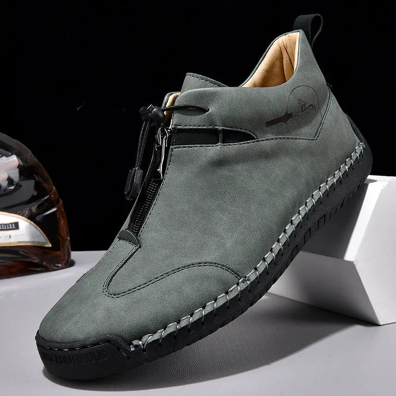 Men's black casual leather shoes with round toe and mid heel on a rubber sole