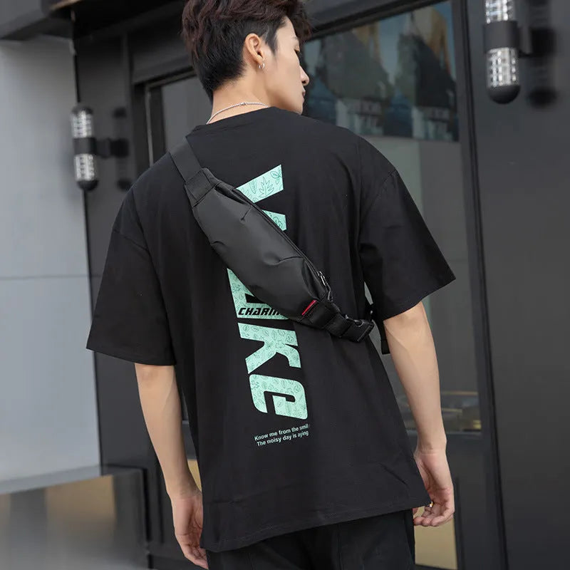 Black men's Oxford cloth crossbody waist pack showing front view and internal phone pocket.