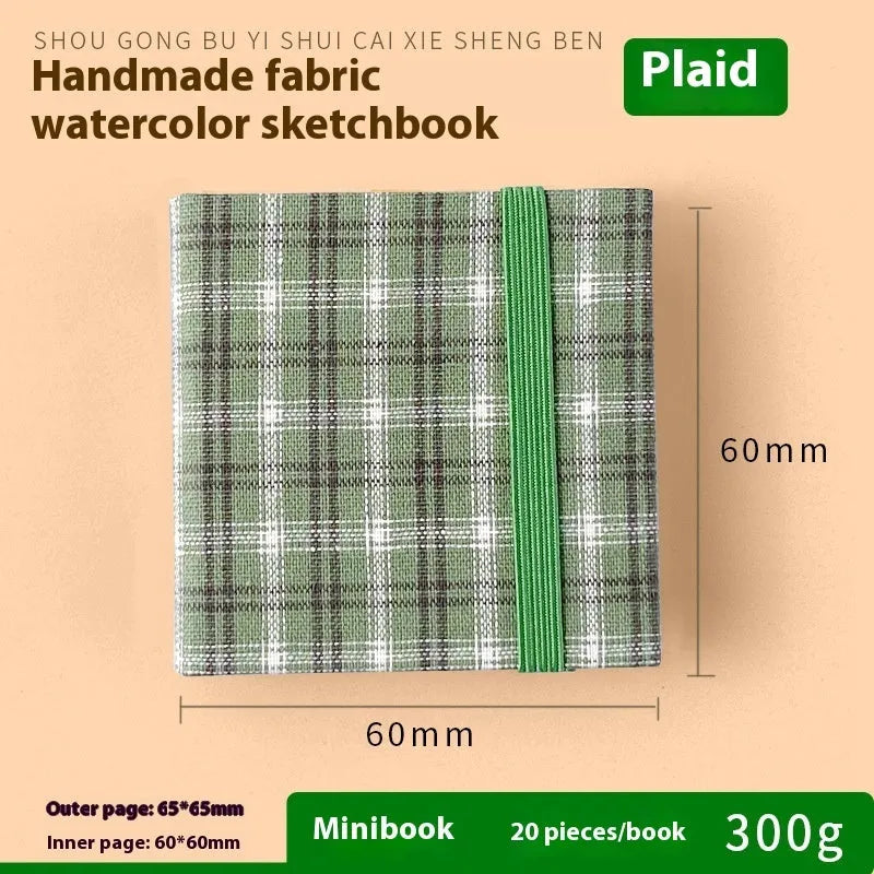 Feiluniao handmade fabric watercolour notebook in 185mm portable size, showing artistic cover design.