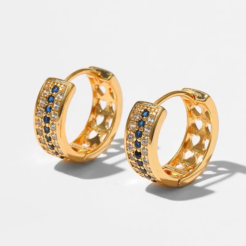Geometric round women's post earrings with a gold electroplated finish on a copper base.