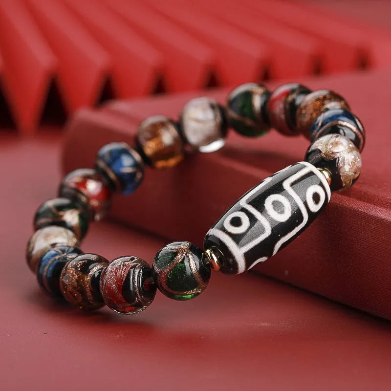 Chinese-style coloured glaze lucky bead bracelet with auspicious patterns for the Year of the Snake.