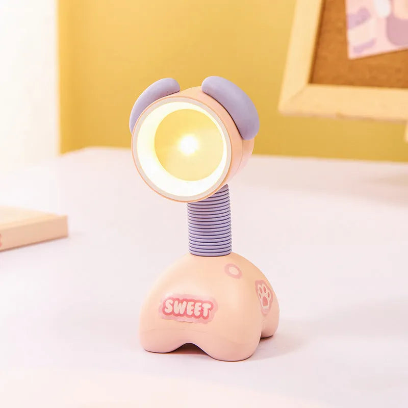 DIY cartoon animal small night lamp with magnetic base in assorted colours on a desk.