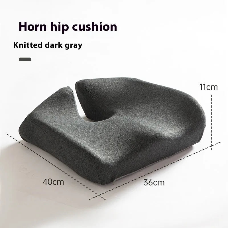 Black memory foam office chair cushion with a solid colour polyester cover, shown on a chair seat.