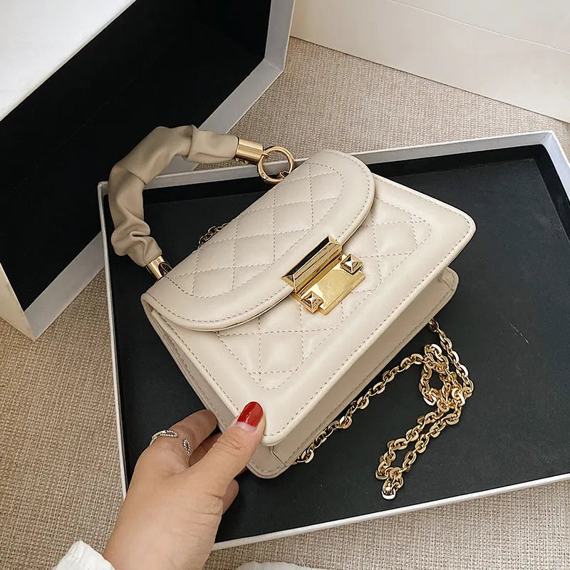 Women's Korean-style shoulder bag with rhombus pattern in purple colour showing crossbody wearing style