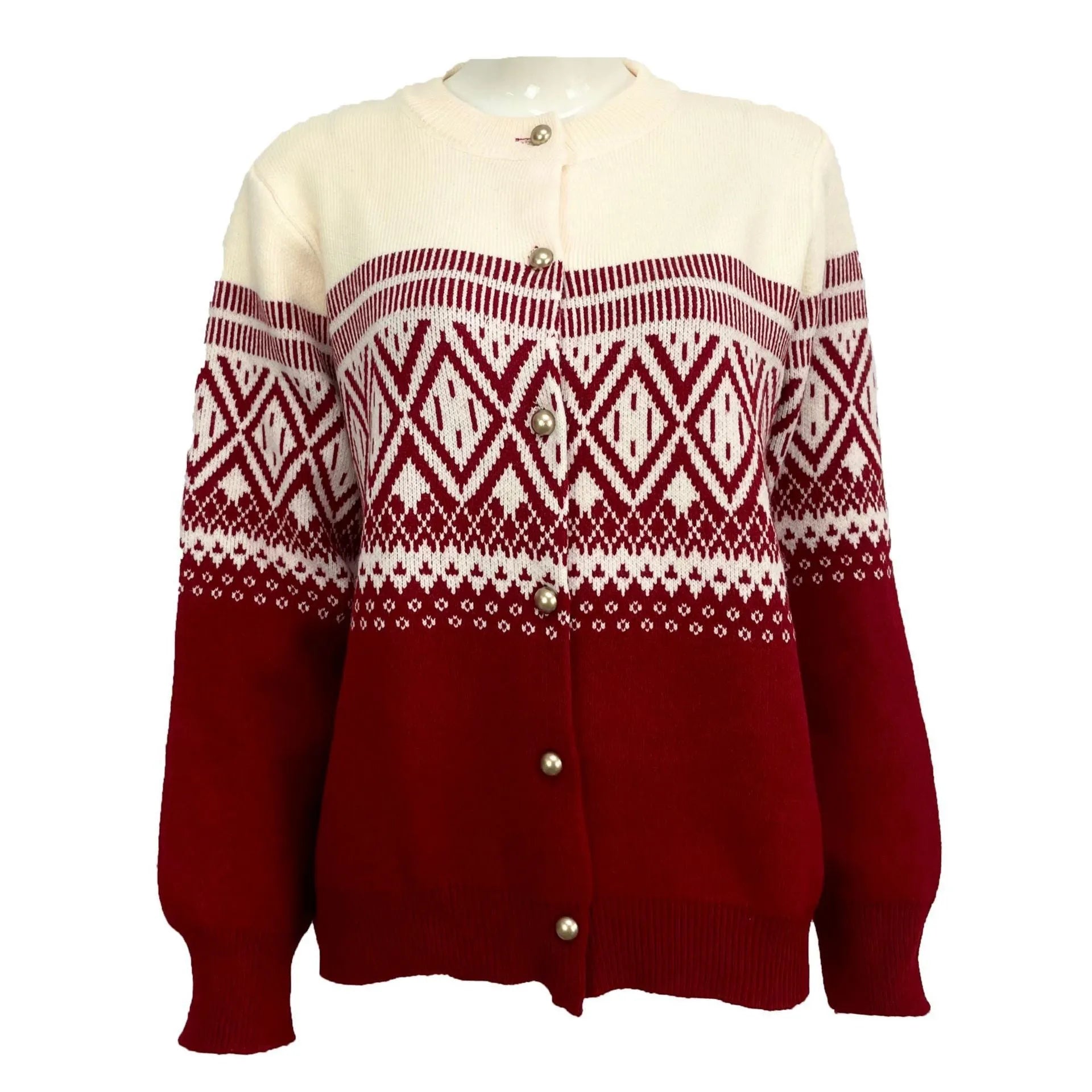 Woman wearing a grey diamond knit cardigan with contrast colour panels, long sleeves.