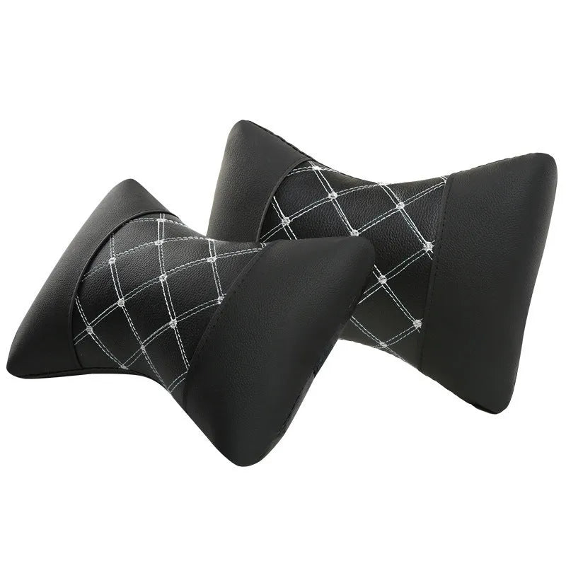 Quilted diamond-pattern black leather car headrest pillow for neck support.