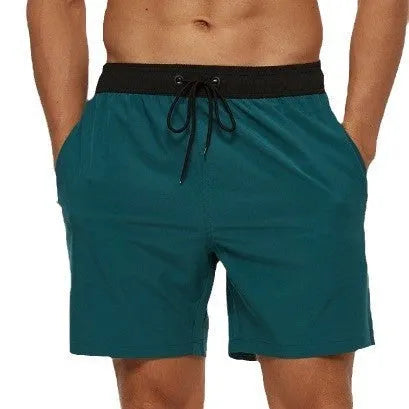 Men's blue athletic shorts with a stitching waistband, drawstring, and side headband pocket.