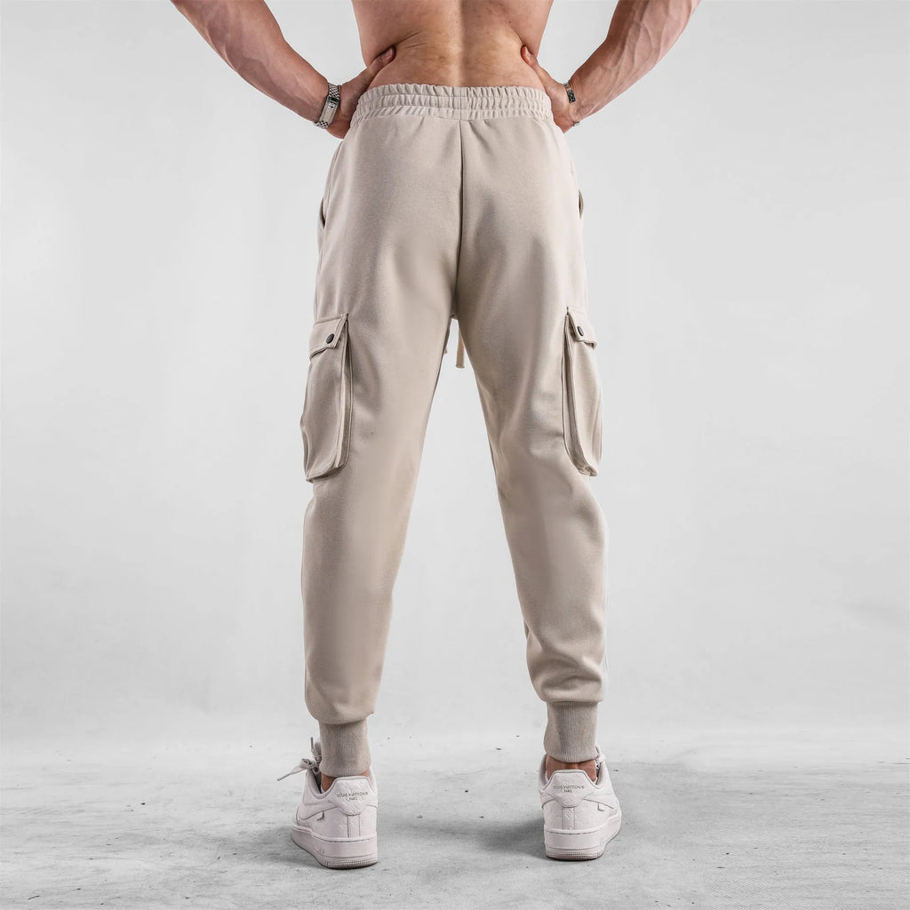 Men's loose cotton sports trousers with ankle ties and multiple pockets in various colour options