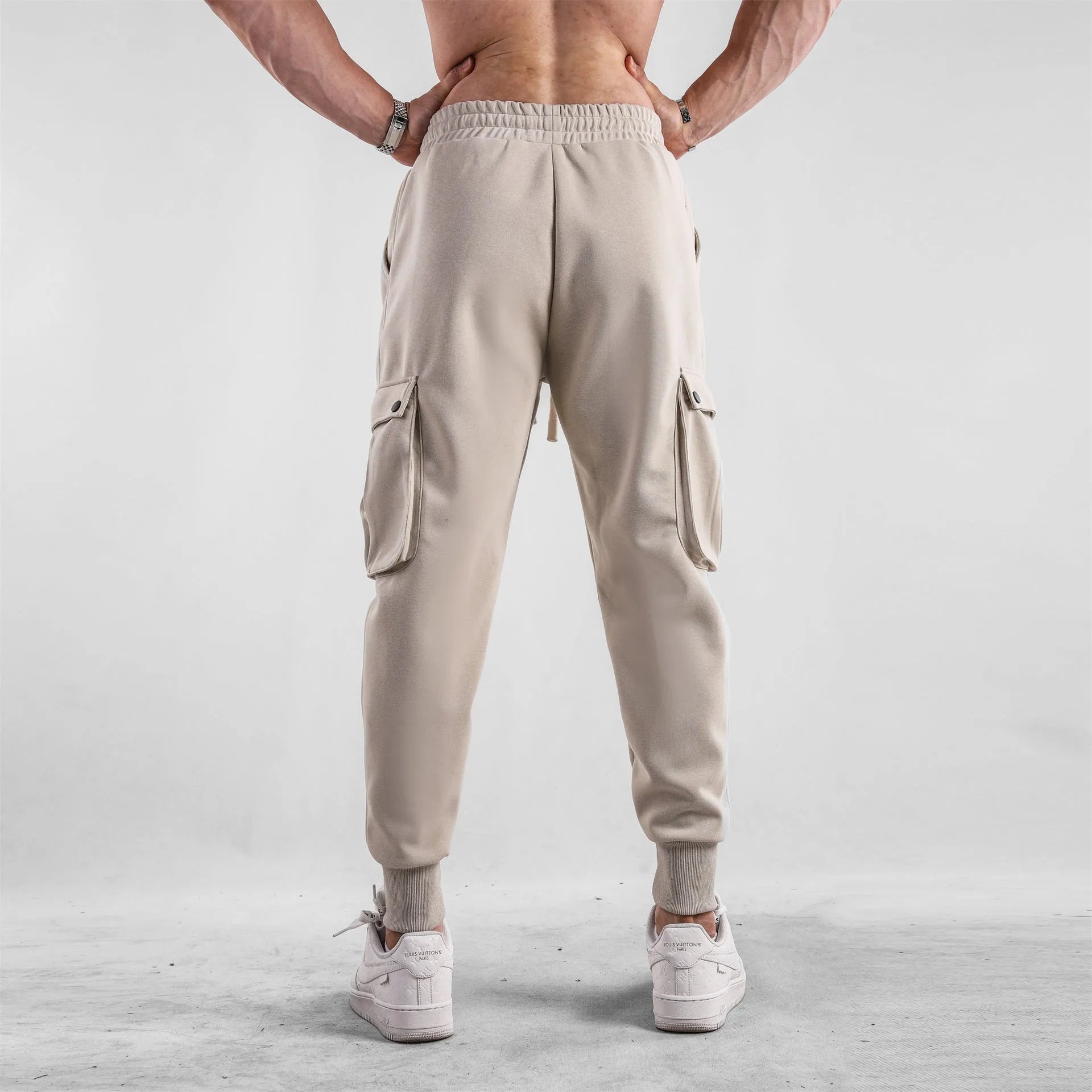 Men's loose cotton sports trousers with ankle ties and multiple pockets in various colour options