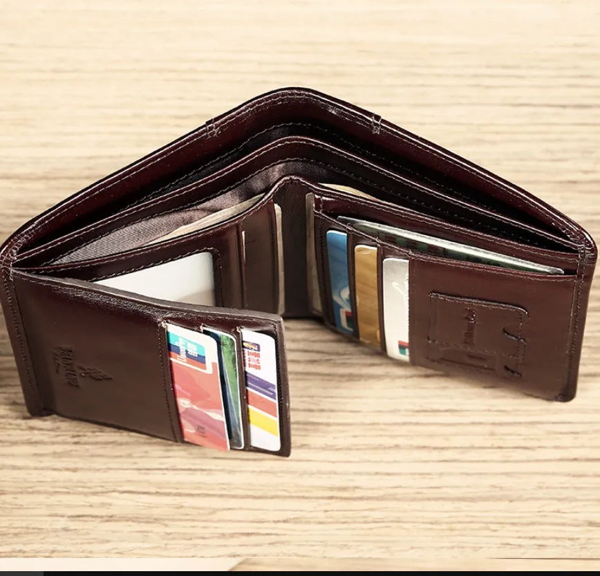 Men's compact leather wallet open showing card slots, change pouch, photo slot, and dark privacy compartment.