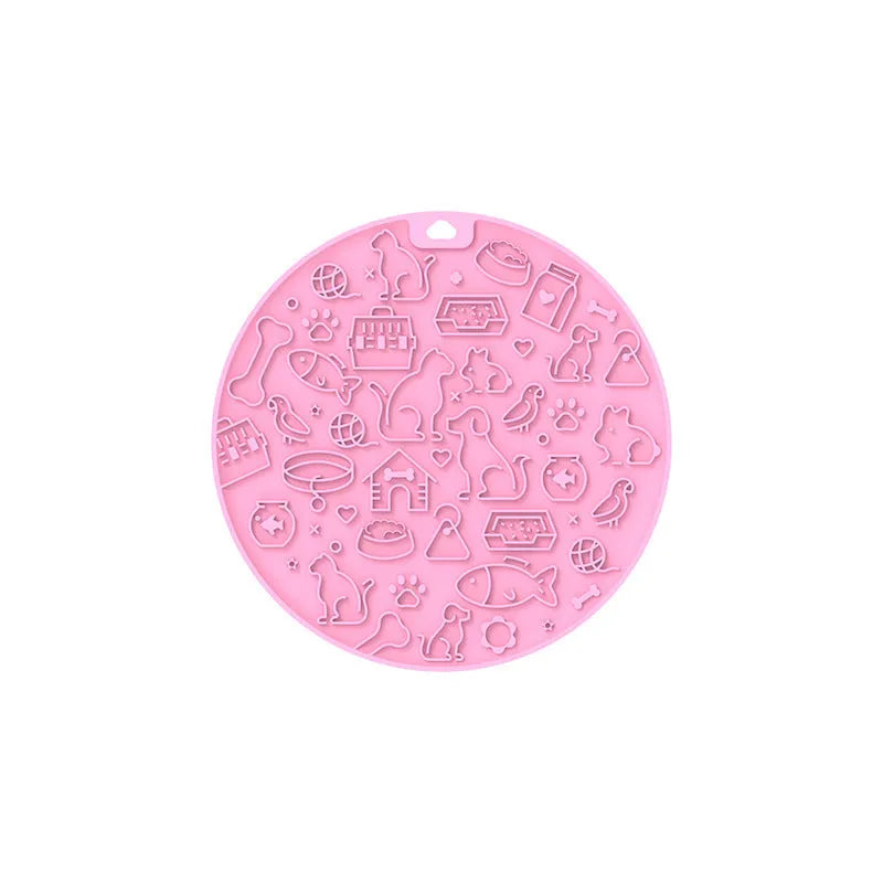 Round grey silicone pet lick mat with textured surface and a clear suction cup on its base.