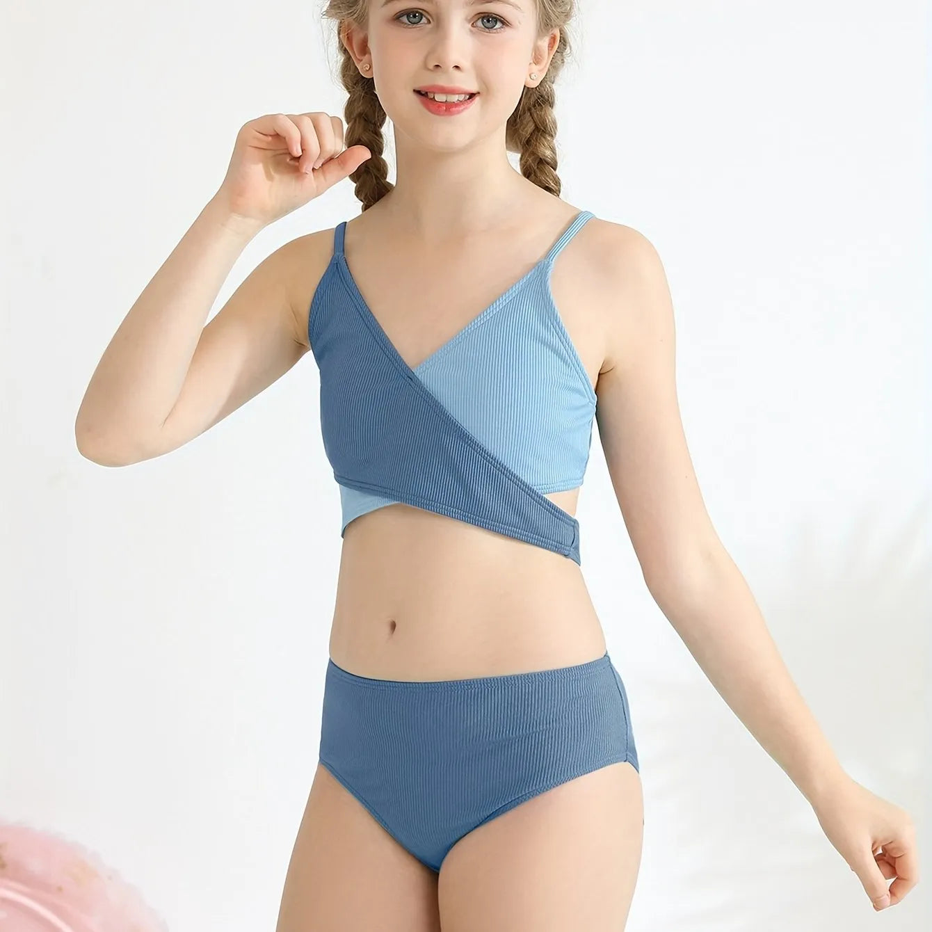 Girls two-piece criss-cross swimsuit set in blue green with polypropylene fabric