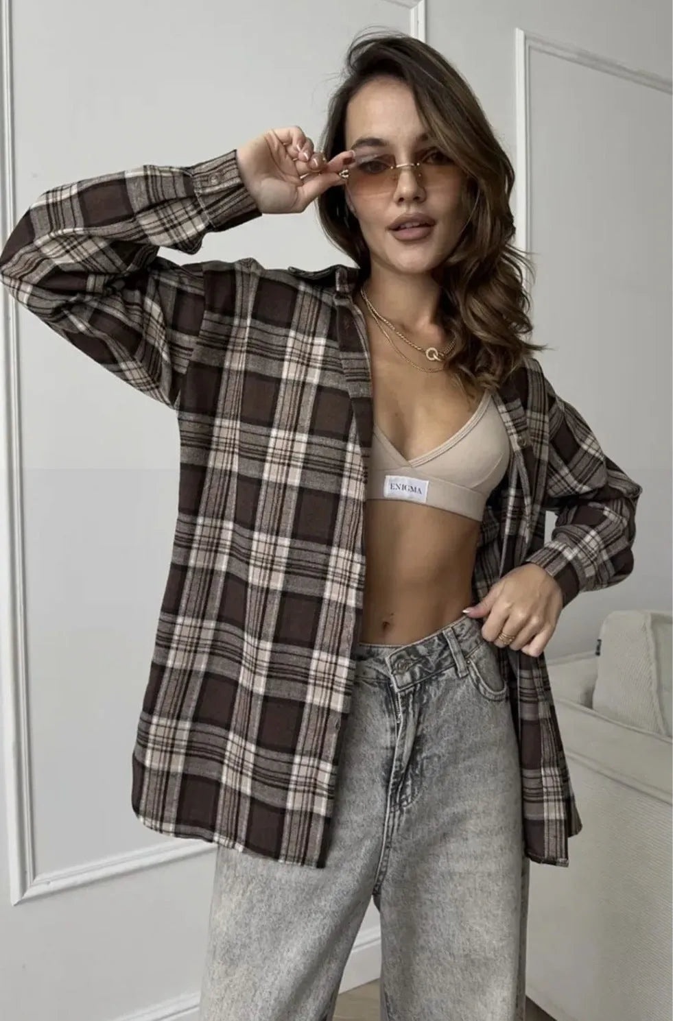 Women's dark brown retro striped long sleeve cotton shirt on a hanger.