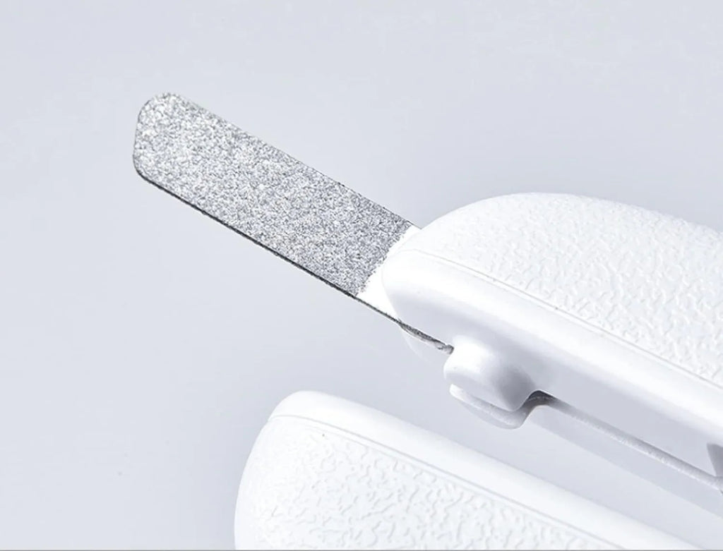 White LED pet nail clipper with a triangular blade, anti-splash guard, and leatherette handle.